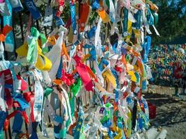 Bulgaria, Romania border, 19.10.2022. Plastic and rag bracelets with the names of hotels in resorts of Bulgaria, left as a souvenir by tourists leaving Bulgaria on the Romanian border photo