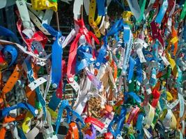 Bulgaria, Romania border, 19.10.2022. Plastic and rag bracelets with the names of hotels in resorts of Bulgaria, left as a souvenir by tourists leaving Bulgaria on the Romanian border photo