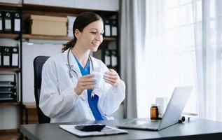 Medical technology concept. Doctor working with mobile phone and stethoscope in office photo