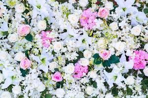 Floral background. Lot of artificial flowers in colorful composition photo