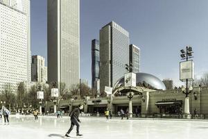 March 4 2023. Chicago, Illinois. People skate on a skating rink in downtown Chicago. photo