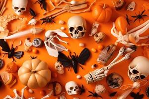 Top view on spooky halloween motifs with bones plastic spiders pumpkins and bats on an orange surface created with technology. photo