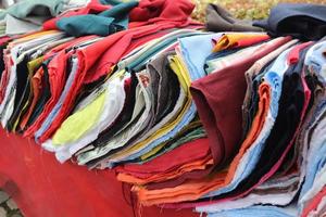 View on samples of cloth and fabrics in different colors found at a german fabrics market. photo