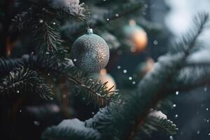 View of Christmas tree decorations on a green coniferous tree with some snow and soft bokeh lights in the background created with technology. photo
