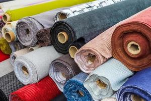 View on samples of cloth and fabrics in different colors found at a german fabrics market. photo