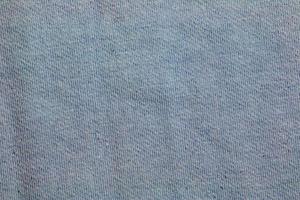 Blue gray fabric texture background. A piece of cotton fabric is carefully laid out on the surface. Textile texture. photo
