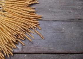 wooden background with dried rice photo