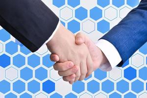 Two business men shaking hands photo