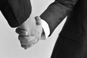 Two business men shaking hands photo