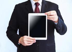 Businessman holding tablet photo