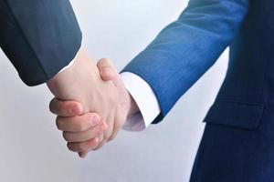 Two business men shaking hands photo