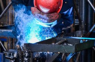 Arc welding of a steel in factory photo
