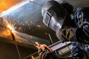 Arc welding of a steel in construction site photo