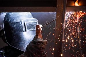 Arc welding of a steel in construction site photo