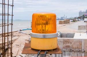 yellow siren in construction site photo