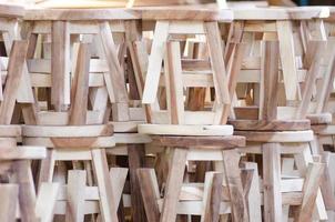 A pile of wooden chair photo