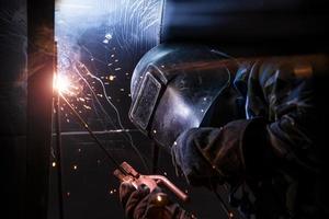 Arc welding of a steel in construction site photo