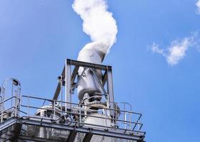 white smoke coming out of industrial chimney photo