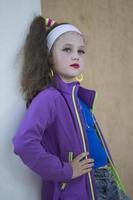 Little girl with bright makeup in retro style. Child model. photo
