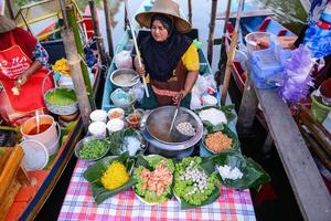 SONGKHLA, THAILAND, April 15, 2018, Sellers sell food and souvenirs at Klonghae Floating Market in Hat Yai, Thailand. The First floating Market in the South of Thailand. photo