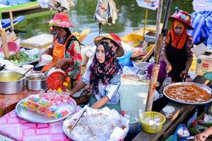 SONGKHLA, THAILAND, April 15, 2018, Sellers sell food and souvenirs at Klonghae Floating Market in Hat Yai, Thailand. The First floating Market in the South of Thailand. photo