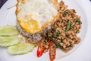 Kapao Moo, Fried pork with chili and basil leaves with rice photo