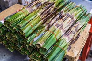 Kanom Jark, Thai sweetmeat made of flour, coconut and sugar with nipa plam leaves photo