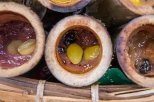 Glutinous rice roasted in bamboo joints photo