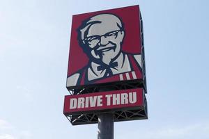 Nonthaburi Thailand 3 March 2023 Outdoor pole billboard with logo KFC Brand with message Drive thru photo