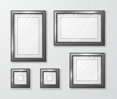 Collection of photo frames on the gray wall. Modern empty frame template with transparent glass and shadow. Vector illustration