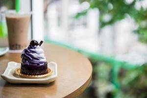 blueberry mousse with chocolate jelly and bubble tea photo