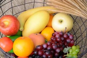 Basket and fresh fruits photo