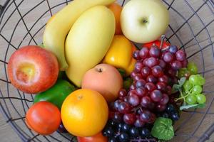 Basket and fresh fruits photo