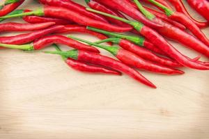red chilies on wood background photo
