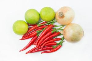 A set of vegetable- chilies, lime, and onion photo