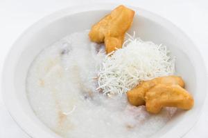 Rice porridge with with fried pastries in Thai style photo