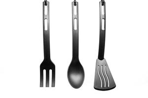 black kitchen utensils on white background photo