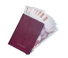 Passport and money on white background photo