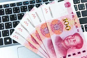 Yuan or RMB, Chinese Currency on laptop's keyboard photo