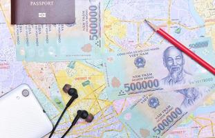 Vietnam and US dollar currency on travel map photo