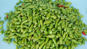 pile of green cayenne pepper photo