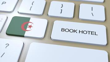 Book hotel in Algeria with website online. Button on computer keyboard. Travel concept 3D animation. Book hotel text and national flag. 3D illustration photo