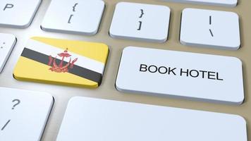 libro hotel en Brunei con sitio web en línea. botón en computadora teclado. viaje concepto 3d animación. libro hotel texto y nacional bandera. 3d ilustración foto