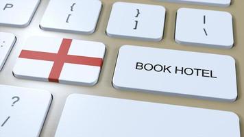 Book hotel in England with website online. Button on computer keyboard. Travel concept 3D animation. Book hotel text and national flag. 3D illustration photo