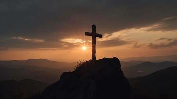 Mountain Majesty Artistic Silhouette of Crucifix Cross Against Sunset Sky photo