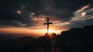 Mountain Majesty Artistic Silhouette of Crucifix Cross Against Sunset Sky photo