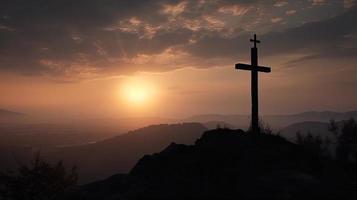 Mountain Majesty Artistic Silhouette of Crucifix Cross Against Sunset Sky photo