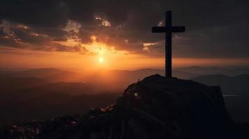 Mountain Majesty Artistic Silhouette of Crucifix Cross Against Sunset Sky photo