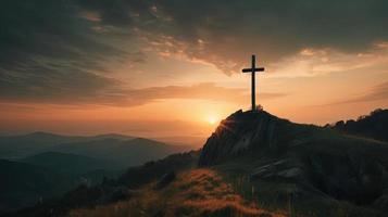 Mountain Majesty Artistic Silhouette of Crucifix Cross Against Sunset Sky photo