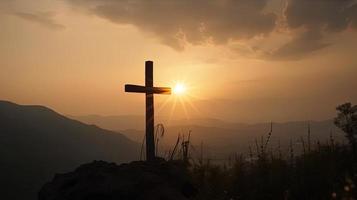 Mountain Majesty Artistic Silhouette of Crucifix Cross Against Sunset Sky photo